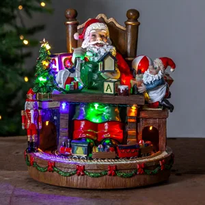 Pozytywka świąteczna Mikołaj przy biurku Led MERRYVILLE